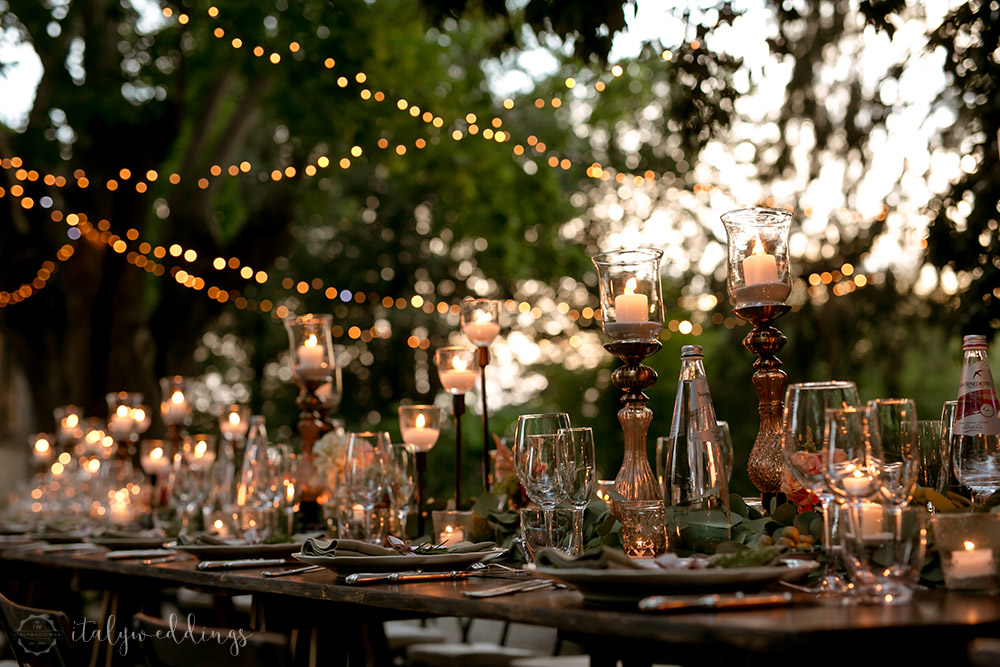 Siena Stomennano wedding evening fairy lights long country table