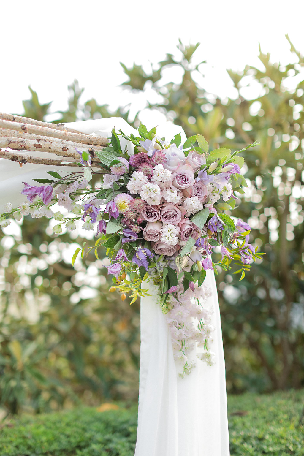 Luxury wedding blessing with secret garden lighting Tuscany arch